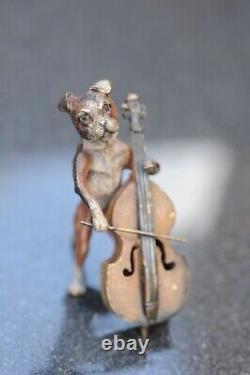 Austrian cold painted dog playing cello by Bergman